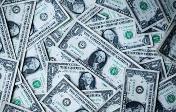 dollar bills in pile