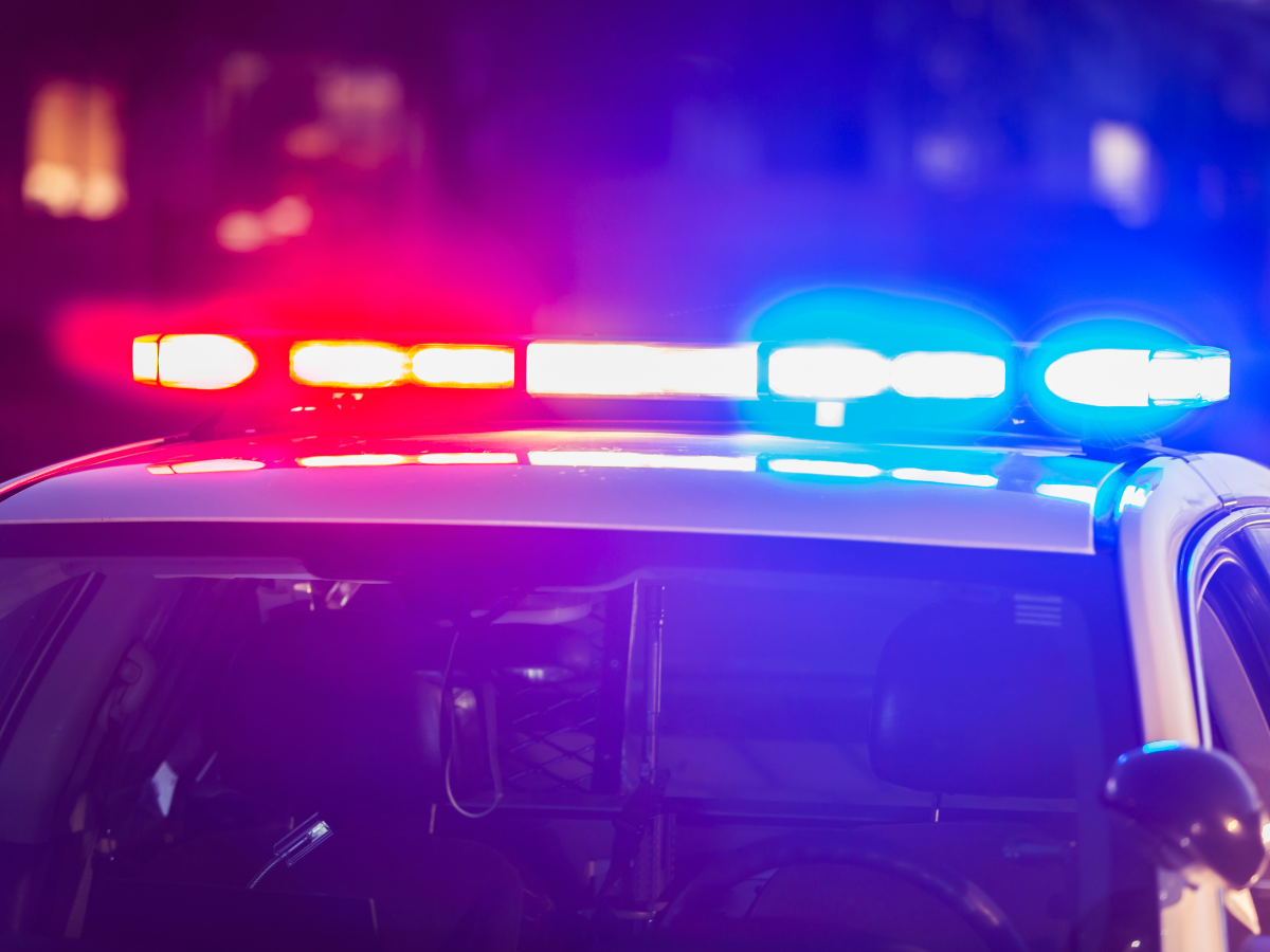blue and red police lights at DUI traffic stop