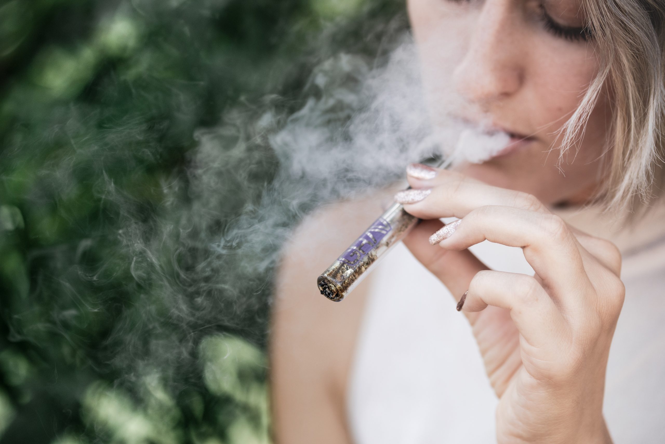 woman smoking illegal drug Criminal defense law firm