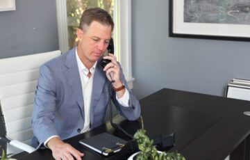 Criminal defense attorney Ben Stechschulte on phone in office