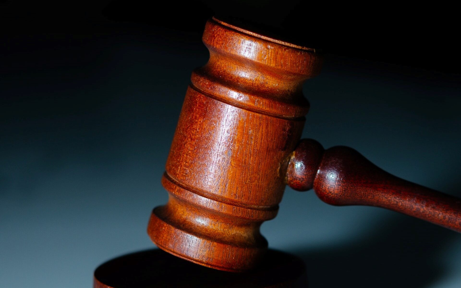 wooden courtroom gavel with dark background