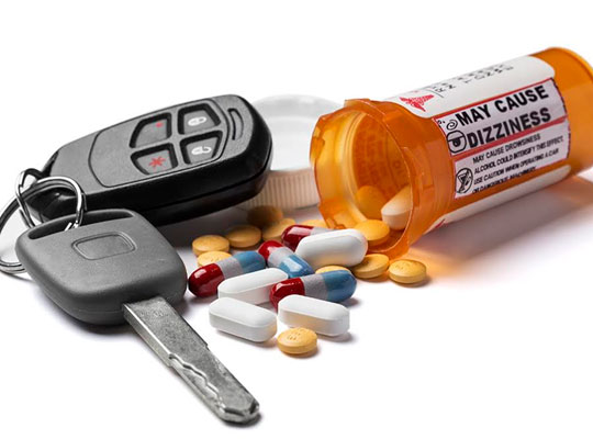 Drug bottle next to car keys DUI drug defense