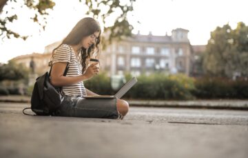 woman college student looking down on college campus