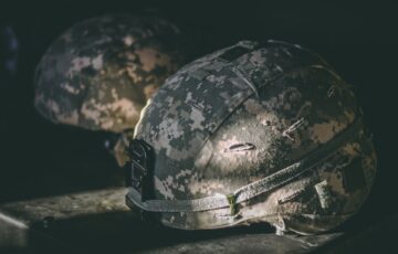 camoflage covered military helmets