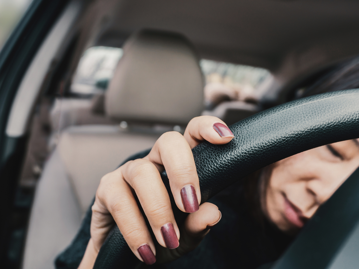 woman asleep behind the wheel DUI