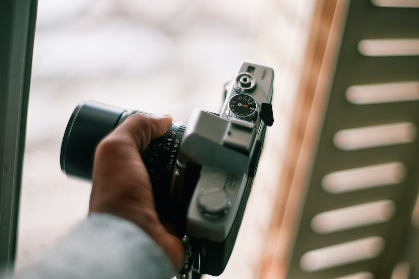 person holding a film camera