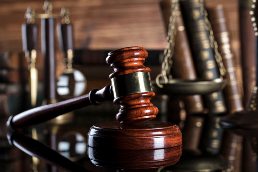 wooden courtroom gavel on wooden table