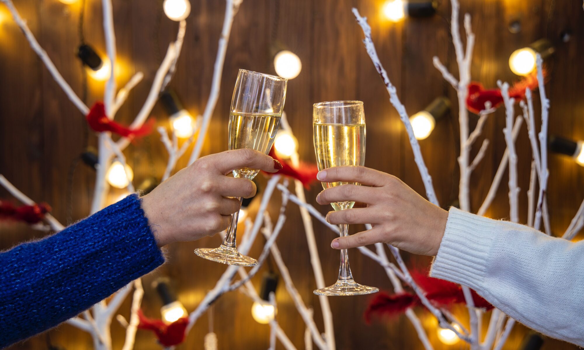 two people drinking champagne during the holidays