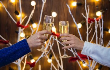 two people drinking champagne during the holidays