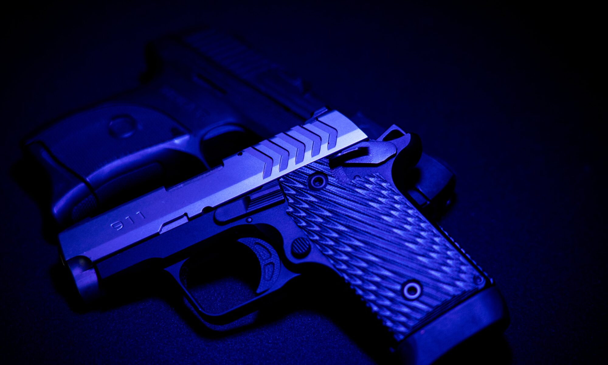 handgun in blue light