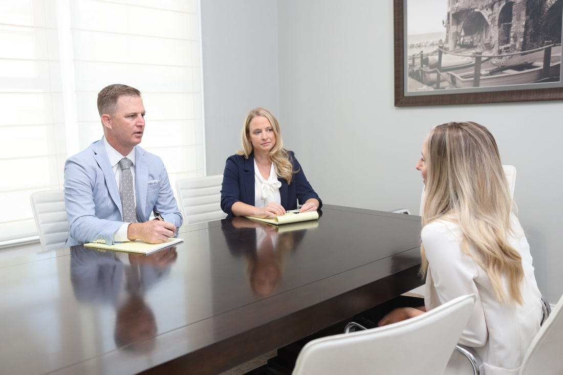 Ben and Amy in meeting with client