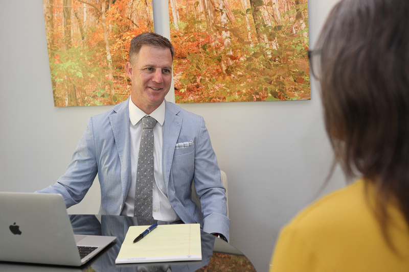 ben stechschulte speaking with a client in tampa office