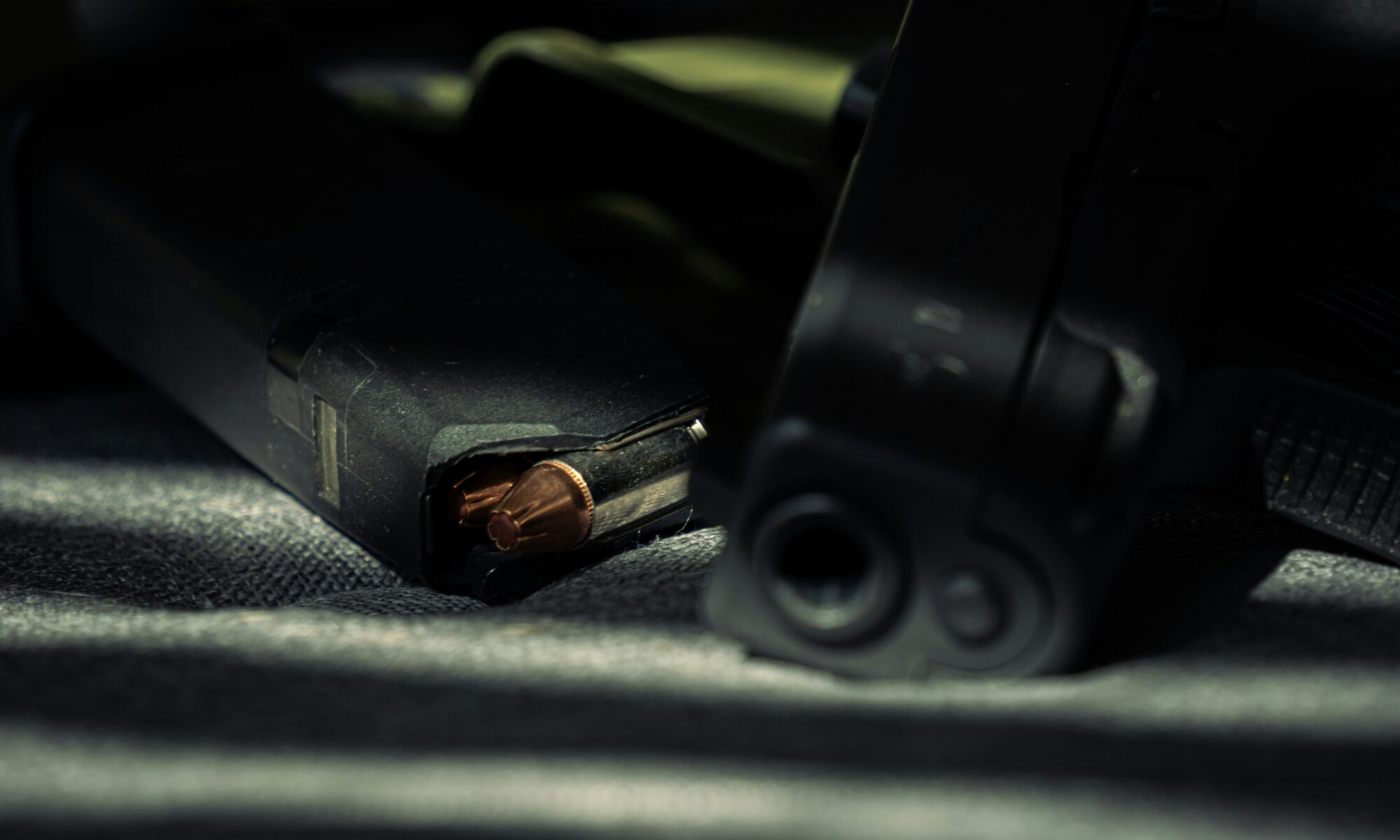 close up of gun on car seat
