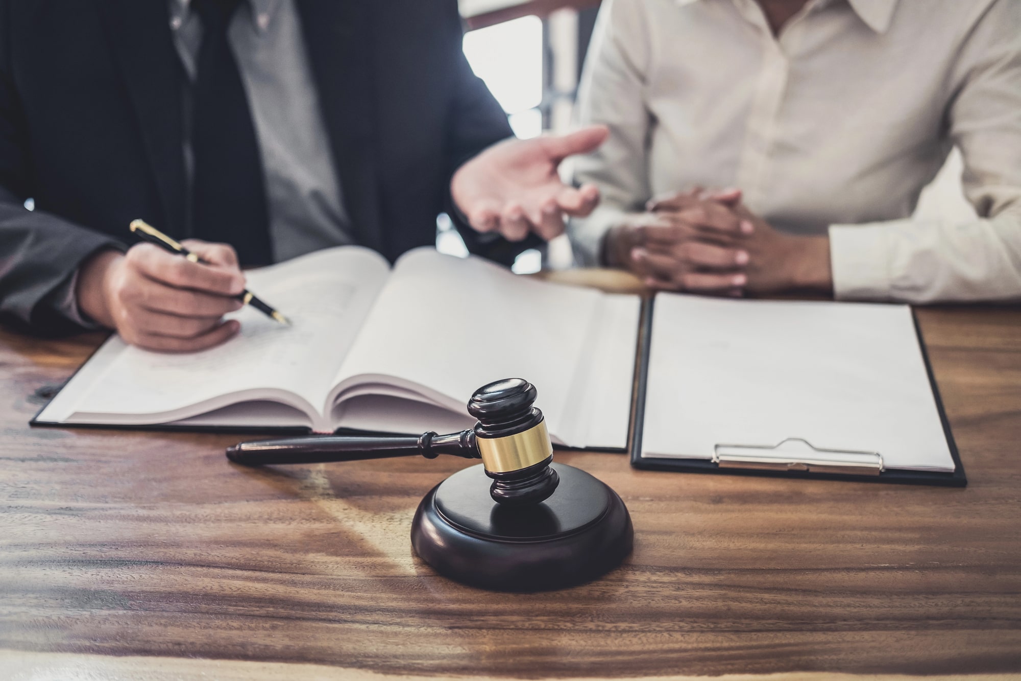 Lawyer meeting with client about assault charges