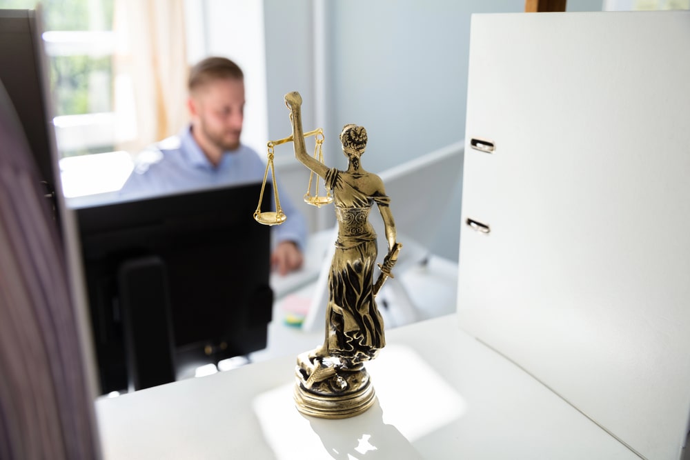 attorney reviewing cryptocurrency fraud case documents